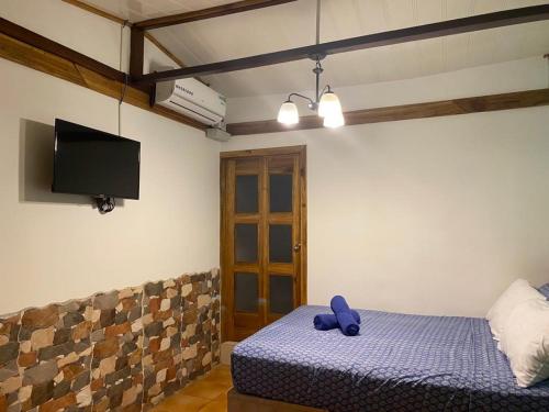 Een bed of bedden in een kamer bij Posada Nena Caribe
