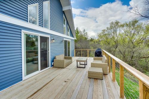 a deck with a couch and chairs on a house at Sleepy Hollow Lake Home with Deck, Pool Access! in Athens