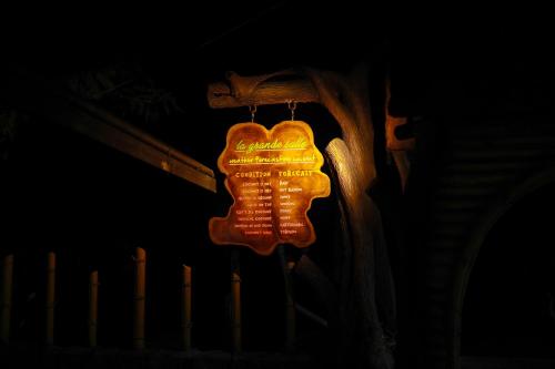 a sign that is hanging on the side of a bench at Belljem Homes -your own private resort -6 BHK S in Trichūr