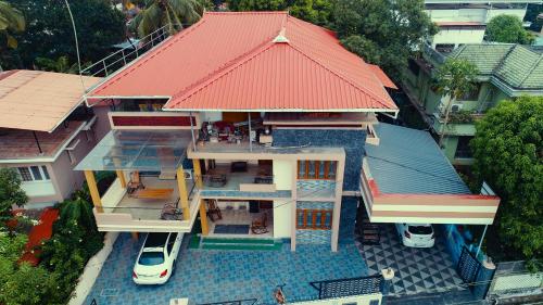 an overhead view of a house with a red roof at Belljem Homes -your own private resort -6 BHK S in Trichūr