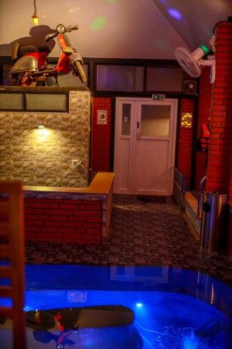 a room with a pool in the middle of a room at Belljem Homes -your own private resort -6 BHK S in Trichūr