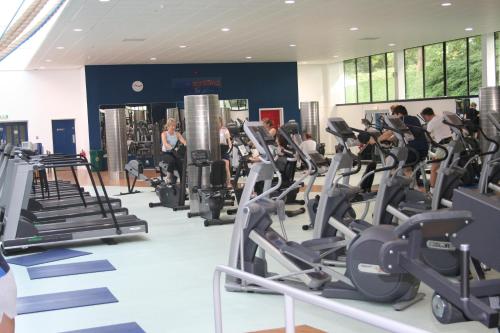 a gym with rows of tread machines and people on treadles at Willow Court in Stirling