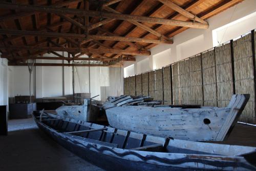 a group of boats sitting inside of a building at CASA VACANZE “ LA TERRAZZA “ in Comacchio