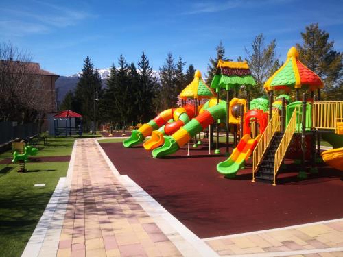 a park with a playground with a slide at CASANTO' in San Demetrio neʼ Vestini