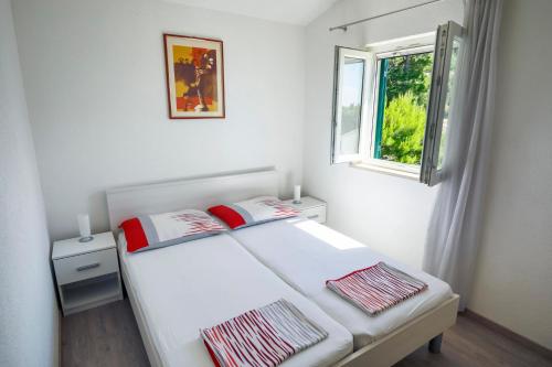 Postel nebo postele na pokoji v ubytování Apartments 1234