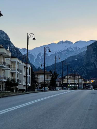 an empty city street with mountains in the background at HOME OF OLYMPOS in Litochoro