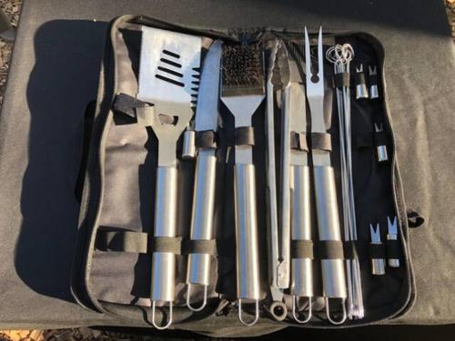 a bag filled with different types of tools at Cozy Wild West Covered Wagon next to River in Grants Pass
