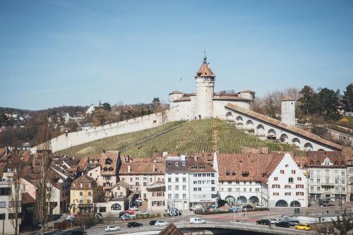 a city with a castle on top of a hill at Ferienwohnung am Sonnenberg in Busingen am Hochrhein