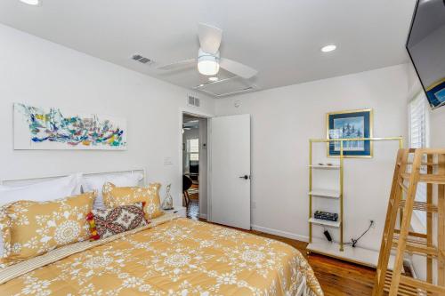a bedroom with a bed and a ladder at 323 W Zarragossa in Pensacola