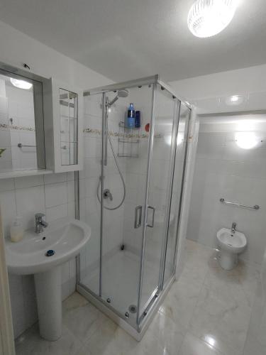 a bathroom with a shower and a sink at Casa Vacanze l' angolo dei Mori in Termini Imerese