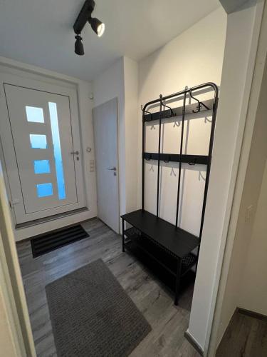 a room with a room with a door and a shelf at E & N Apartments in Oberhausen