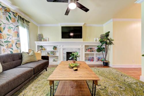 a living room with a couch and a table at Lemonade Lodge in Oklahoma City