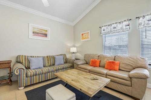 a living room with a couch and a coffee table at Rain Dancer in South Padre Island