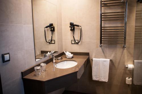 a bathroom with a sink and a mirror at Montemar in Llanes