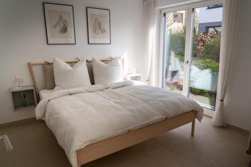 Postel nebo postele na pokoji v ubytování Design Apartment Alpenvorstadt