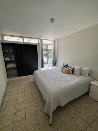 Postel nebo postele na pokoji v ubytování Casa Cariño Room 1