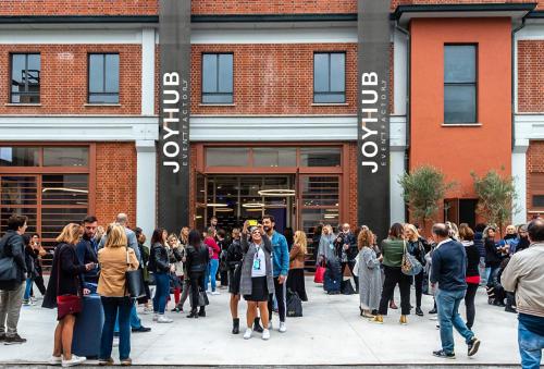 a crowd of people standing outside of a store at Smart loft in Milan - in Milan