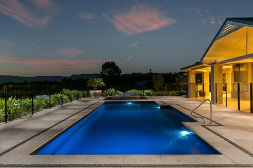 a swimming pool in the backyard of a house at Cullengetty Estate in Berry