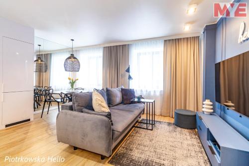 a living room with a couch and a table at MYE Apartments - Piotrkowska 44 in Łódź