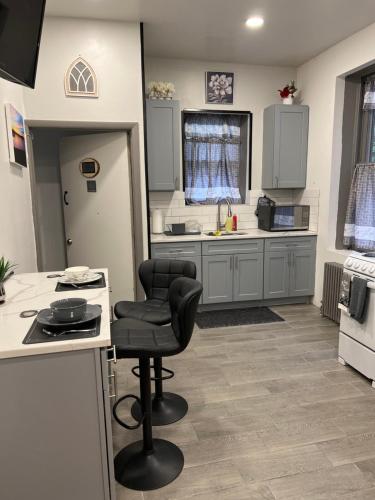 a kitchen with a black chair in the middle at F.M.T. in Harrisburg