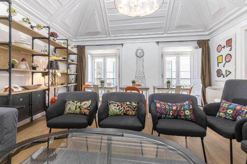 a living room with chairs and a glass table at Bairro Alto Palace Special for Groups up to 24 guests in Lisbon