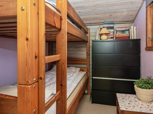 a bunk bed in a room with a desk at Holiday home Haderslev XLV in Haderslev