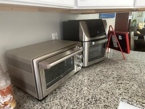 a kitchen with a toaster oven and a microwave at Destin-y 30A Beach Retreat Self Checkin - Huge Private Backyard Deck with Outdoor Shower in Santa Rosa Beach