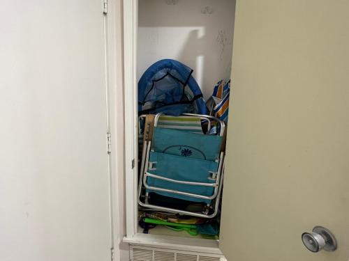 a closet with a pile of luggage in a room at Spacious, cozy villa w/parking in Coligny Villas in Hilton Head Island
