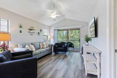 a living room with a couch and a table at Beach Place at True Blue - Close to the beach! in Pawleys Island