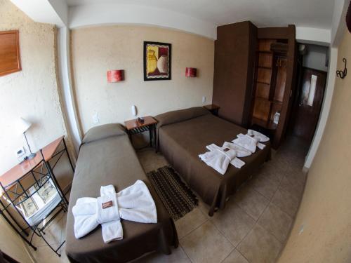 Llit o llits en una habitació de Hotel Samka