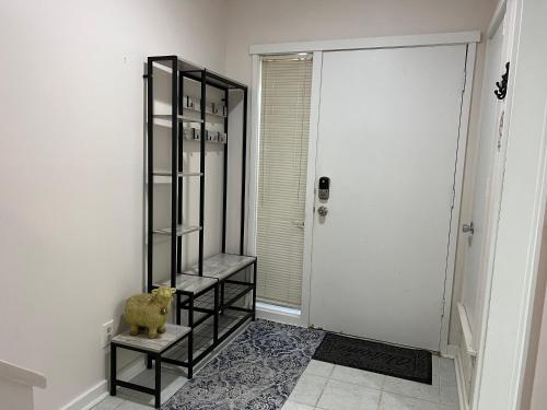 a black book shelf in a room with a door at Spacious, cozy villa w/parking in Coligny Villas in Hilton Head Island