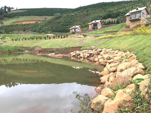a group of people standing next to a body of water at Valle Piemonte in Divisa