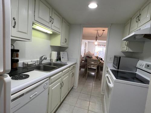 a kitchen with a sink and a stove top oven at Spacious, cozy villa w/parking in Coligny Villas in Hilton Head Island