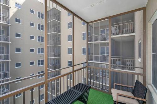 a balcony of a apartment building with a bench at 21st floor condo in the center of Atlanta in Atlanta