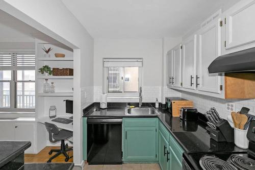 a kitchen with a sink and a counter top at 21st floor condo in the center of Atlanta in Atlanta