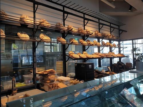 a bakery with a bunch of pastries on display at Junibino Hotel Hongdae in Seoul