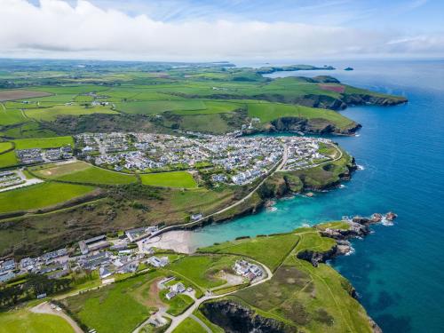 an aerial view of a town next to the ocean at Harbour Lodge in Port Isaac