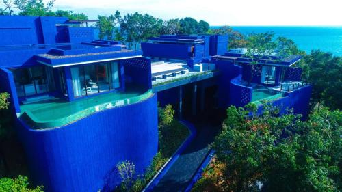 an overhead view of a house with blue walls at Sri Panwa Phuket Luxury Pool Villa Hotel - SHA Plus in Panwa Beach