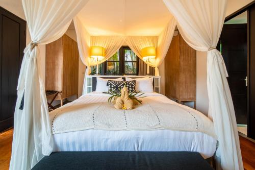 Postelja oz. postelje v sobi nastanitve Lotus Luxury Villa Seminyak