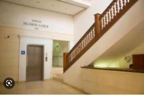 a hallway of a hospital with a staircase and a door at 306Hermoso, céntrico y acogedor loft en Cartagena in Cartagena de Indias