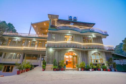 a large brick building with a orange door at Wow Homestay I Kasauli in Kasauli
