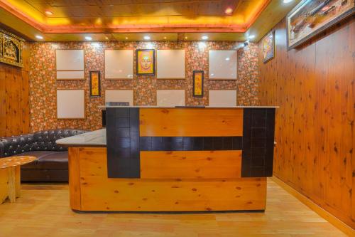 a bar in a room with wooden walls at Wow Homestay I Kasauli in Kasauli