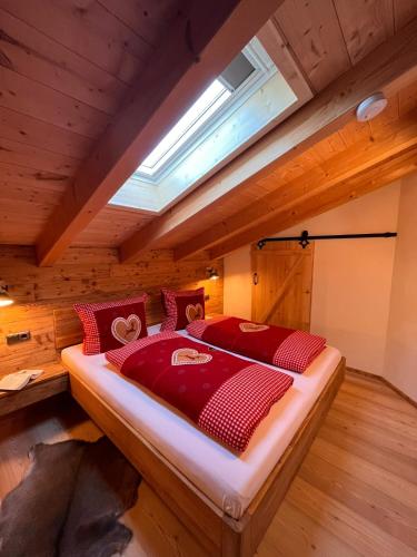 a bedroom with a large bed in a attic at Auf'm Feggenlehen in Ramsau