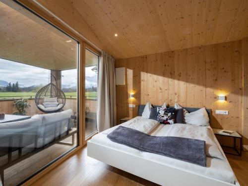 a bedroom with a large bed and a large window at Two Summits in Prama
