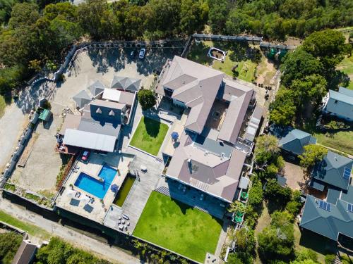 an aerial view of a house with a pool at Issaquena Heights Boutique Hotel in Knysna