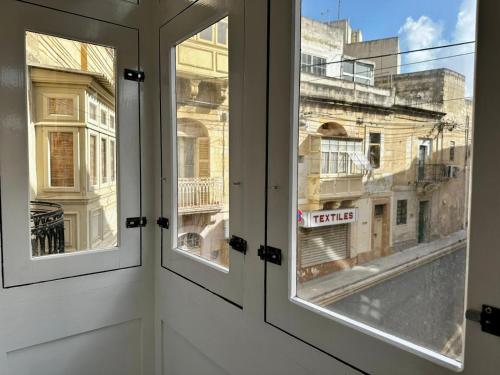 a view from the window of a building at Modern Private apt - Walking distance to Valletta in Tad-Duluri