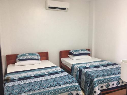 מיטה או מיטות בחדר ב-Donadel Hometel
