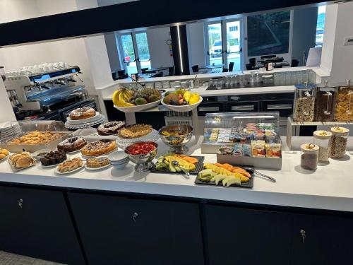 a buffet line with many different types of food at HOTEL MOSAICO in Matera
