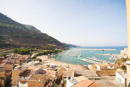 a view of a harbor with boats in the water at Dimore Barraco - SiciliaDaMare in Castellammare del Golfo
