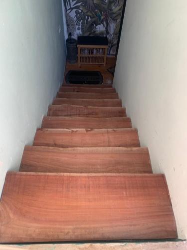 a stairway with wooden steps leading up to a room at פינה קסומה בהר in Lotem